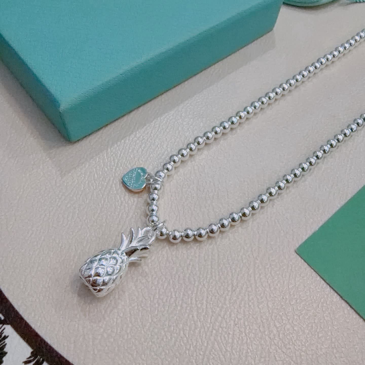 Tiffany & Co. Silver Beaded Necklace with Pineapple Charm